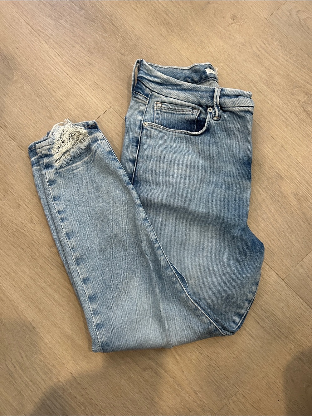 Good American Light Blue Skinny Jeans with Distressed Hem